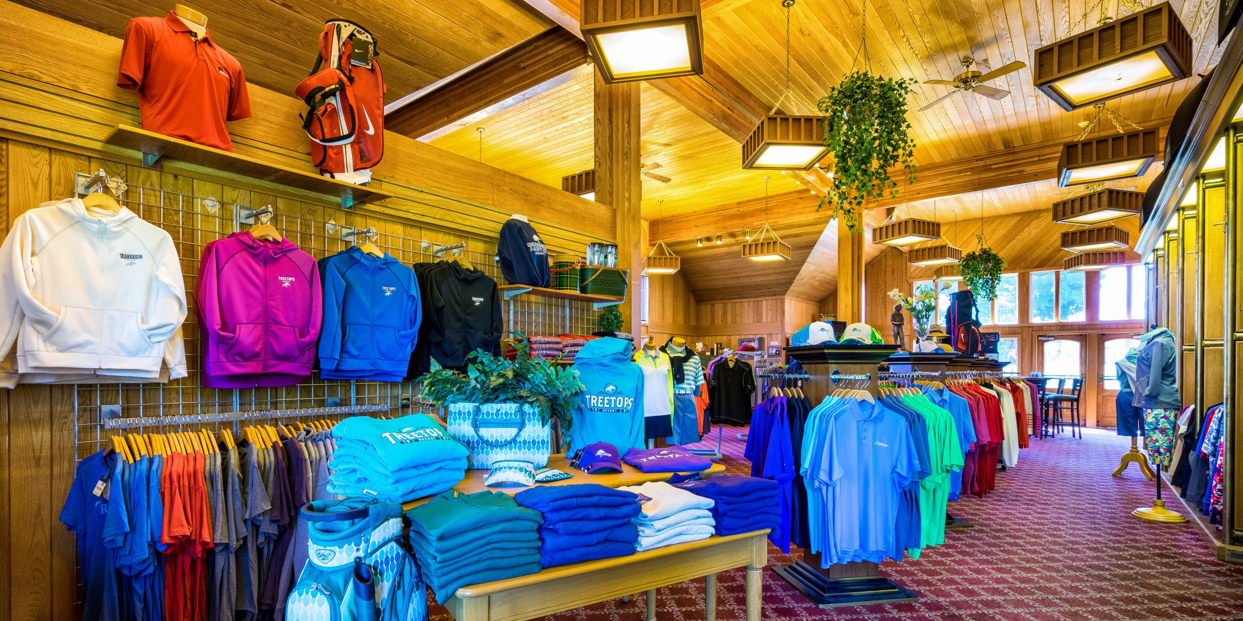 Polo shirts, sweatshirts, golf bags, and more on display at the Jones Pro Shop at Treetops Resort.