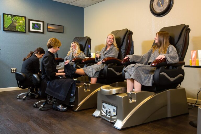 ||A brown-haired woman's relaxed face during a neck massage at the Treetops Resort Spa.